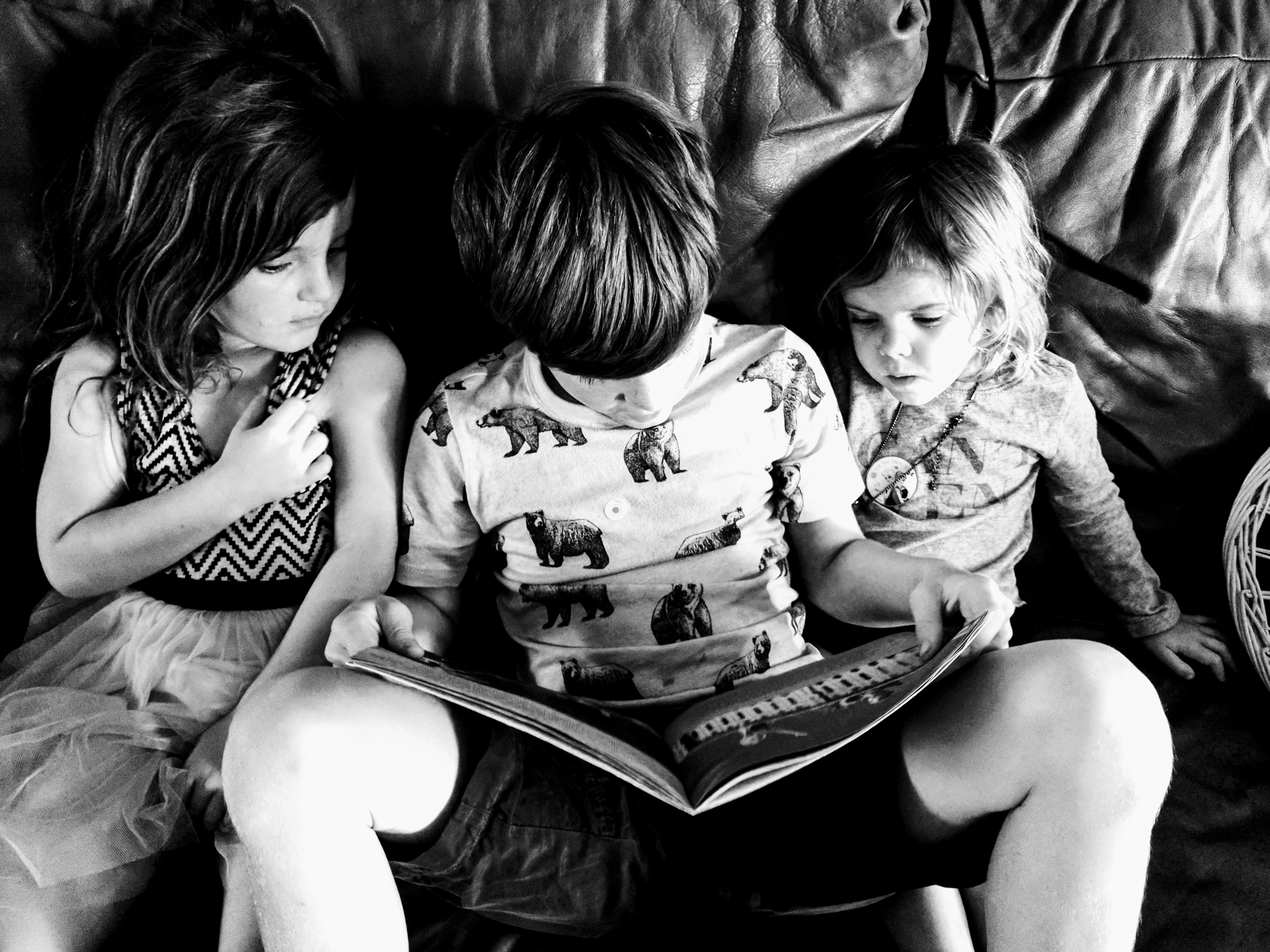child reading to others
